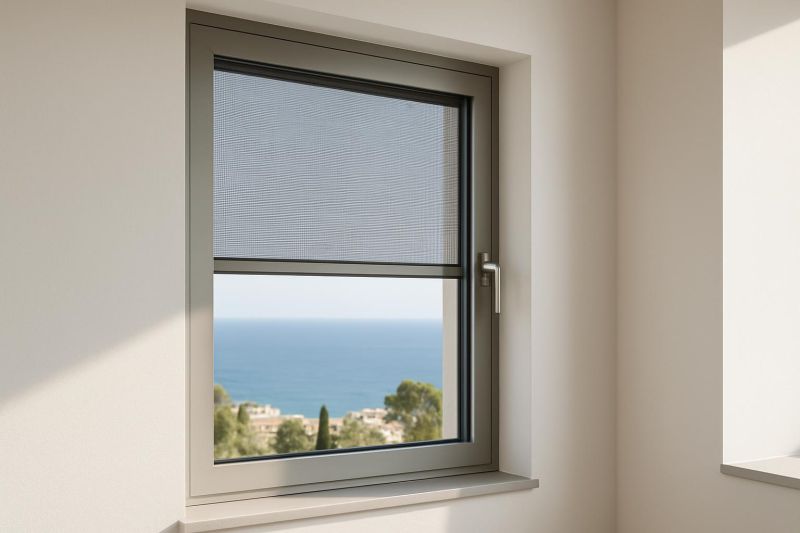 Mosquitera integrada en ventana moderna